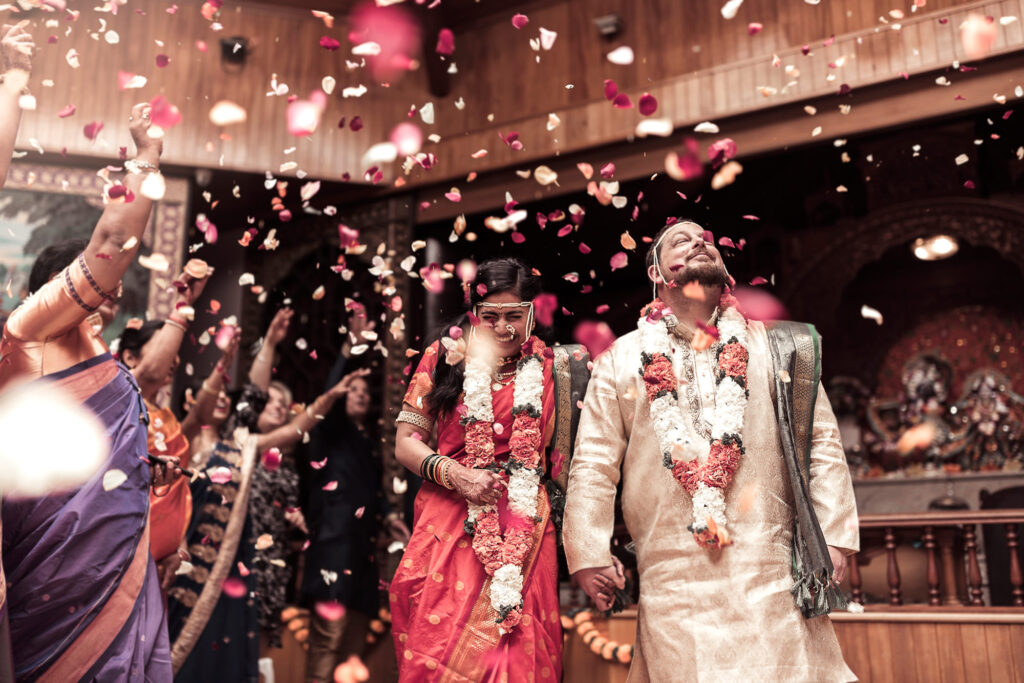 wedding-happy-couple-with-rose-petall-confetti.jpg