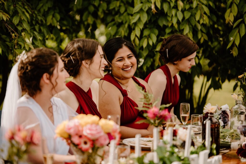 bridesmaid-laughs-during-speeches-at-hamilton-wedding-makeup-by-heather-oatway-makeup-artistry-Large.jpeg