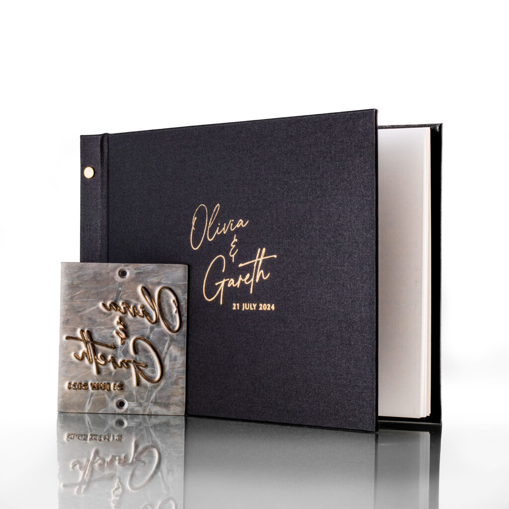 black-guestbook-custom-deboss-with-plate-upright.jpg