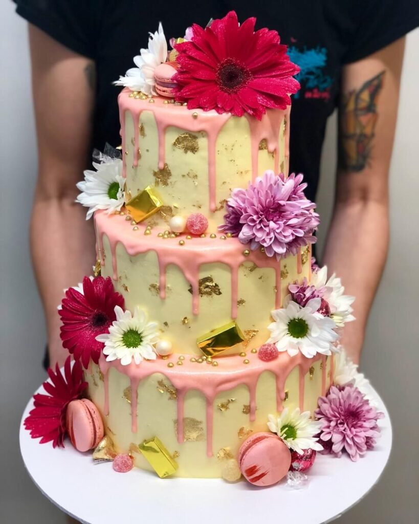 Three-Tier-Smooth-Cream-with-Pink-Drip-Fresh-Flowers-and-Gold-Leaf.jpg