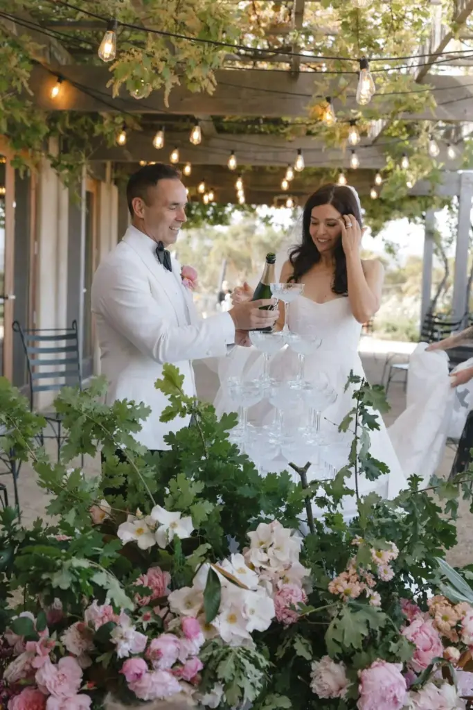 marry-me-mish-bride-and-groom-toasting-champagne-1.webp